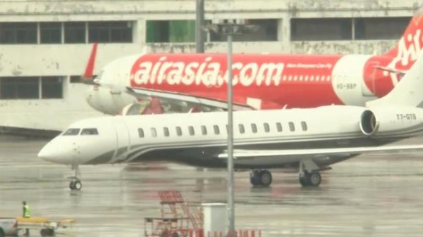 尚红网 他信抵达曼谷 将于9日听取法院裁决 回国面对判决